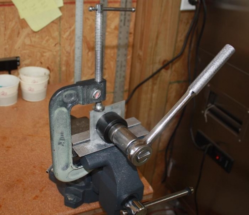 Hole punch to make room in flange for sender.