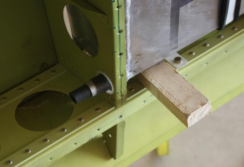 Sleeved nipple and wood shim.