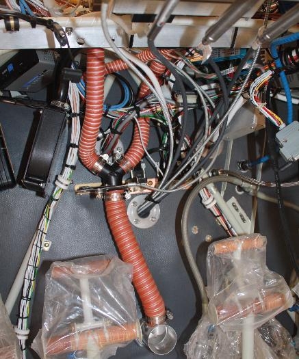 Under panel view of defrost hoses.