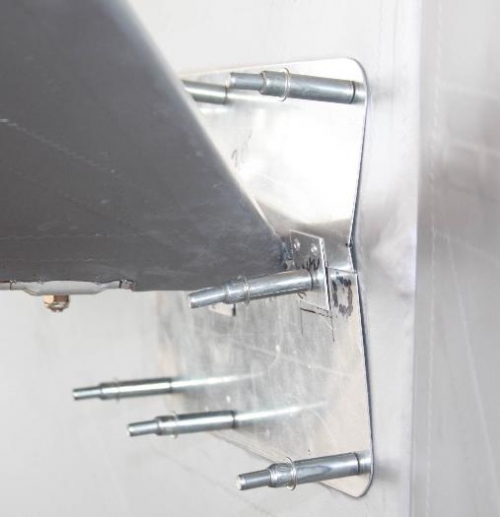 Drilling support tabs provisionally held by pop rivets.