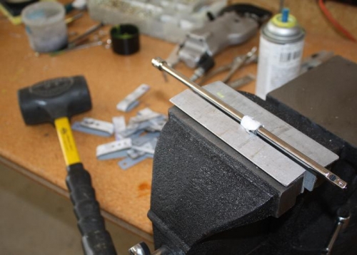 Pounding strap down.