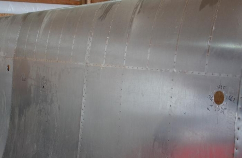 Upper wing skin doubler holes are dimpled.