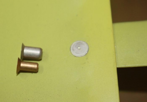 Cheater and standard rivet, driven trailing edge rivet.