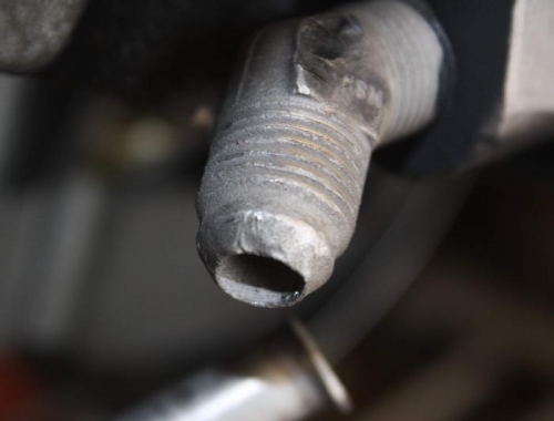 Raggedy looking oil return fitting.