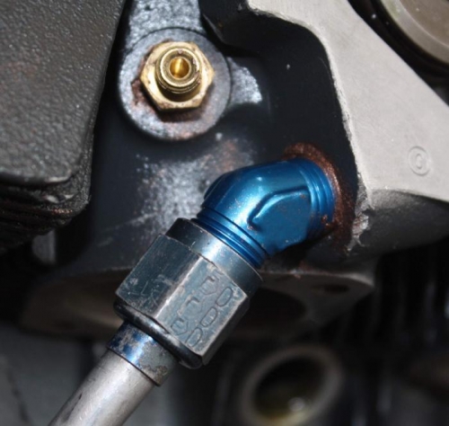 After breaking, drilling and retapping.