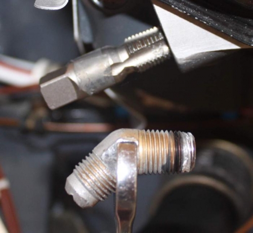 Tapping oil return boss.