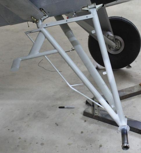 Right landing gear replaced; oversize tire mod, brake holes, mid-hose tab and fairing nutplates added.