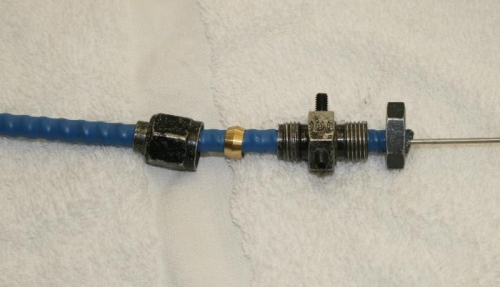 Cowl flap cable bulkhead clamp.