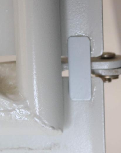 Thin aluminum strips adhesed in place.