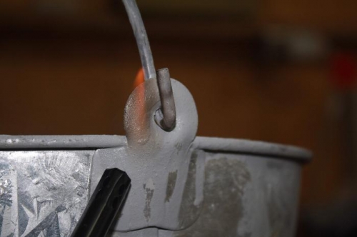 Applying open flame for one minute.