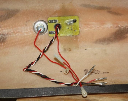 Wingtip Nav/Strobe fixture wiring view showing glassed in retaining backing plate.