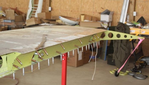 Upper surface riveted.