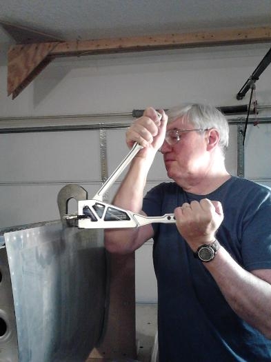 Squeezing skin to rear spar rivets