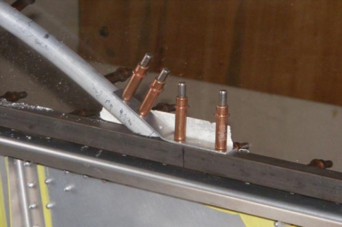 The forward hoop attach points to the canopy rail.