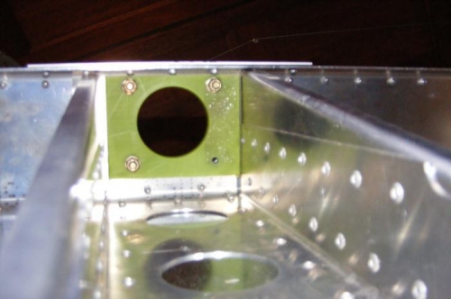 Nylon bearing for nose wheel strut in firewall.