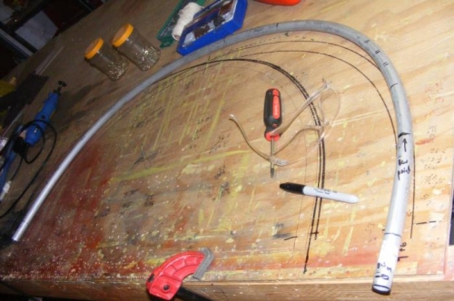 An image of the various stages of bending with previous iterations marked on the workbench.