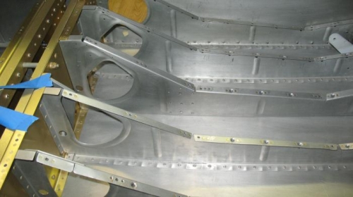 Holes in seat rib for doubler plate