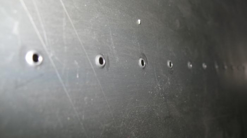 Closeup of dimpled holes