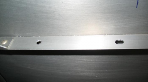 Elo0ngated hole in the stiffener for the bearing block