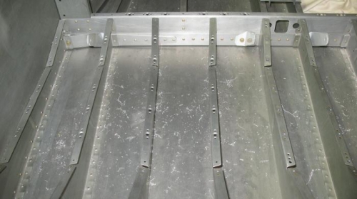 Drilled, deburred and dimpled nutplate holes