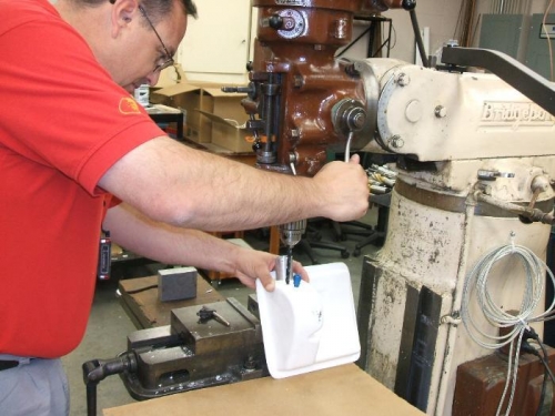 Drilling additional hole in tank