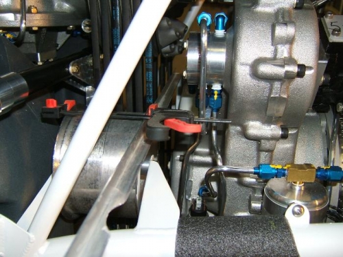 Straight edge clamped to idler to check squareness to belts