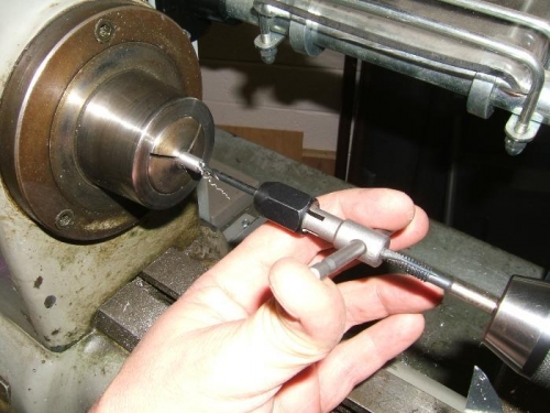 Tapping latch pins