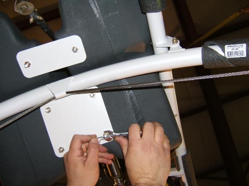 Tightening lower spreader plates