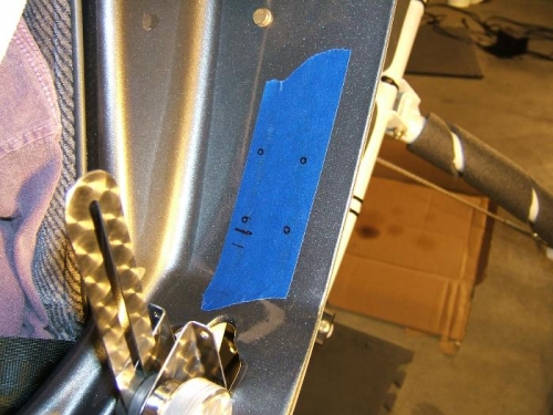 Marking the holes to mount the friction base to the seat pan
