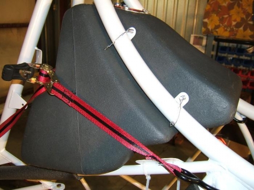 Ratchet strap pulling tank tight