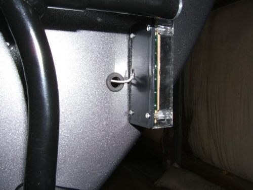 Hole and grommet for strobe wire