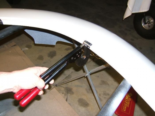 Squeezing the striker plate rivets