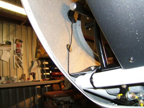 Antenna secured clear of the pedals