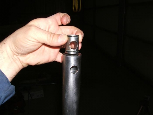 Main shaft plug / head pin shear lock