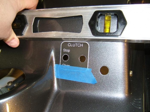 Squaring label to seat edge