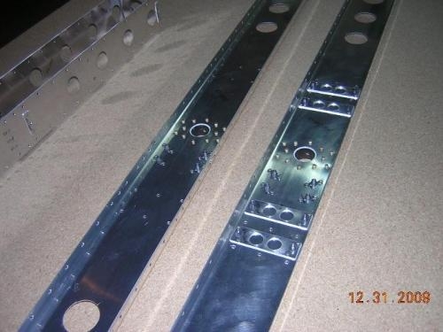 Stabilator spar nutplates riveted in place