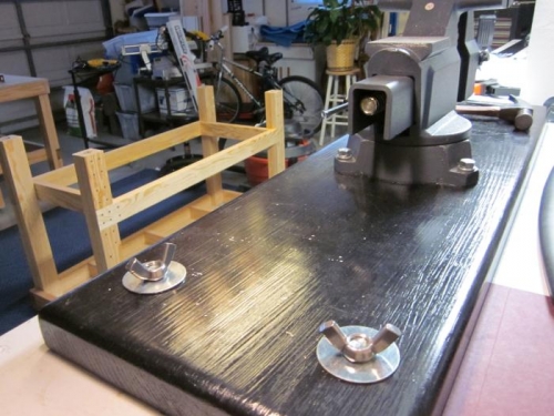 4 Bolts hold in place that are easily removed.