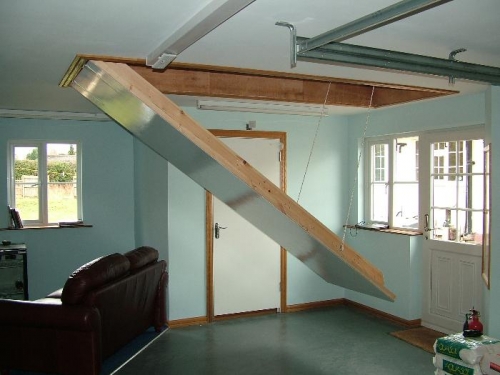 Automatic staircase, saves on room, courtesy of Paul Rackham Builders