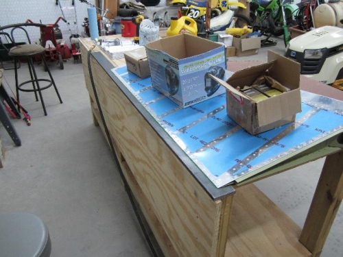 Weighted boxes to hold rudder down while I riveted.