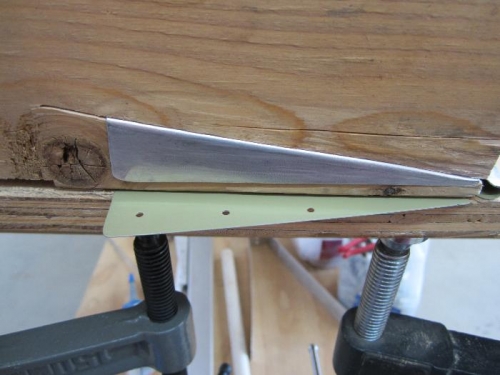 The bottom end gets bent first.