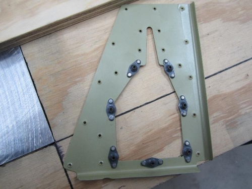 Riveted nutplates to trim reinforcement bracket