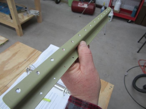 Top holes of E-607 trim tab spar countersunk.