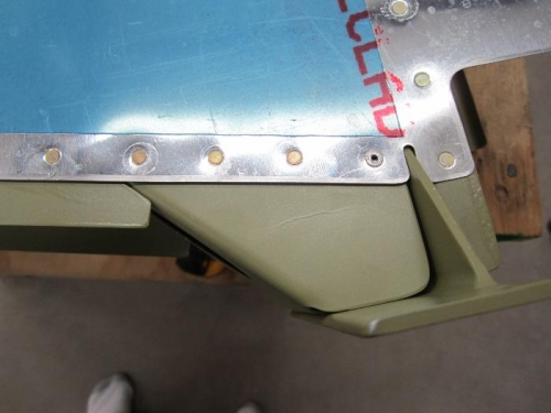 One pop rivet on each side.