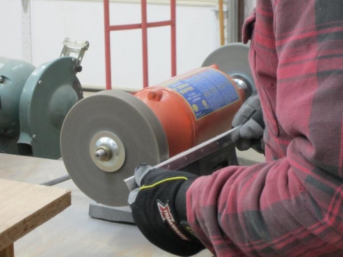 Deburring on scotch brite wheel.