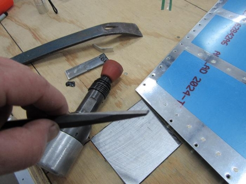 Masonry punch and flat crowbar in distance.