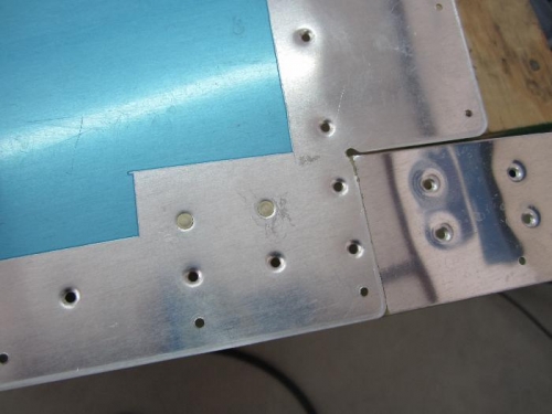 These two rivets on top and bottom get set  first .