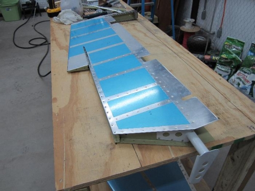 Left elevator skin riveted on.