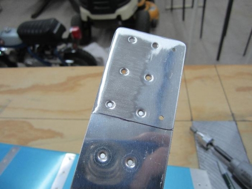 Beveled inboard & aft edges of E-713.