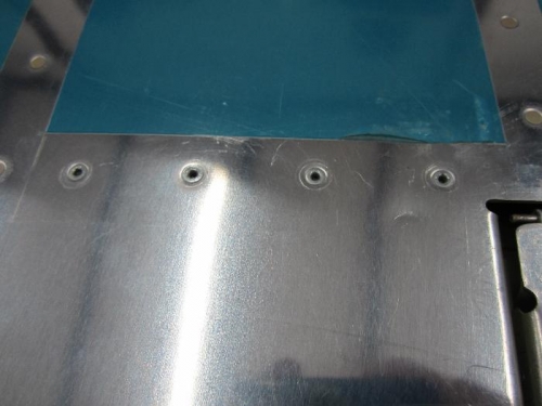 I let my pop riveter slip and got this ding below the right rivet.