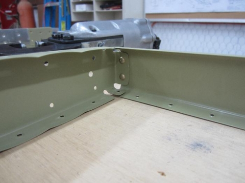 Riveted E-704 counterbalance rib first then E-703 end rib.